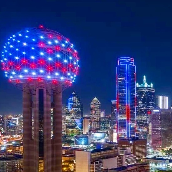 Reunion Tower in Dallas lit up in a flag pattern