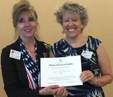 First Vice Regent Donna Moore presents an award to Susan Schwertz for her work on the DAR Good Citizens Committee, which provides student scholarships.