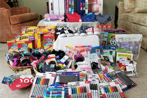 Chapter donations for the back-to-school program at the women's and children's shelter.