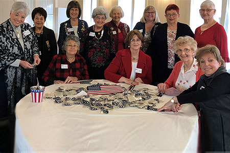 1.	Members folding pocket flags to send to deployed troops